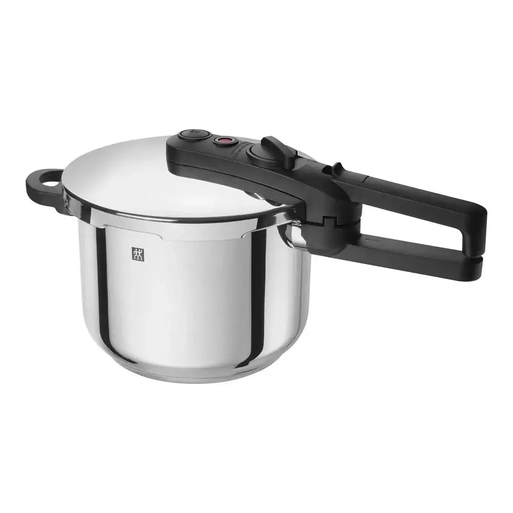Stainless steel pressure cooker with black handle on a white background