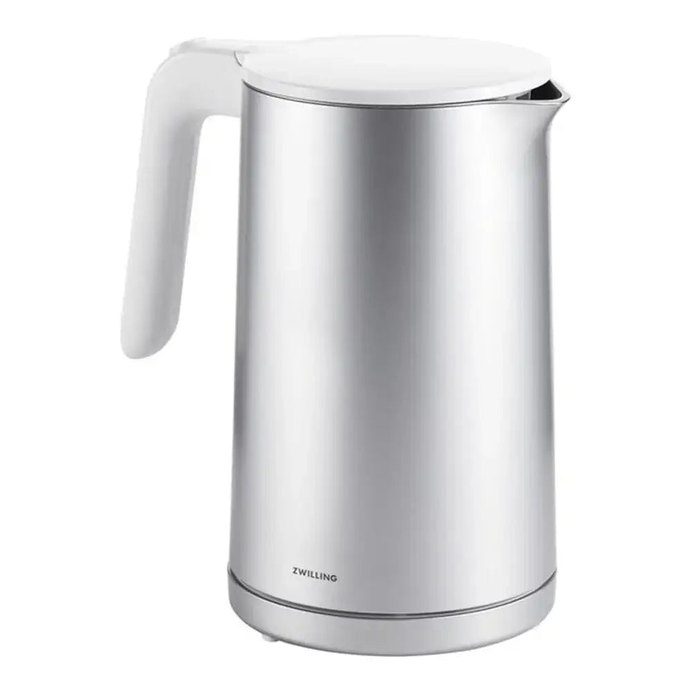 Stainless steel kettle with white handle on a white background