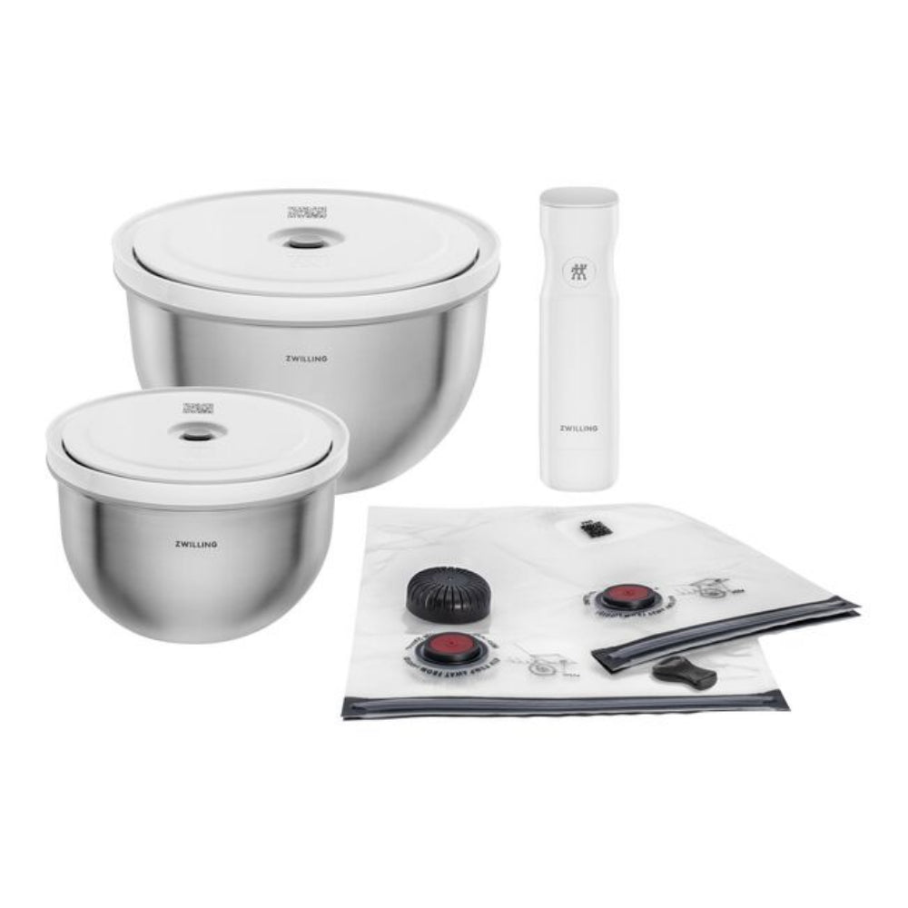 Set of stainless steel kitchen items including bowls, a bottle, and a mat on a white background.