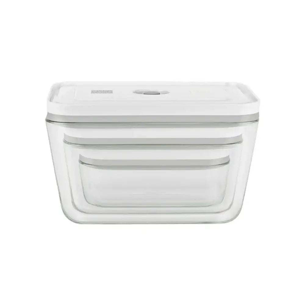 Clear glass food storage container with white lid on a white background