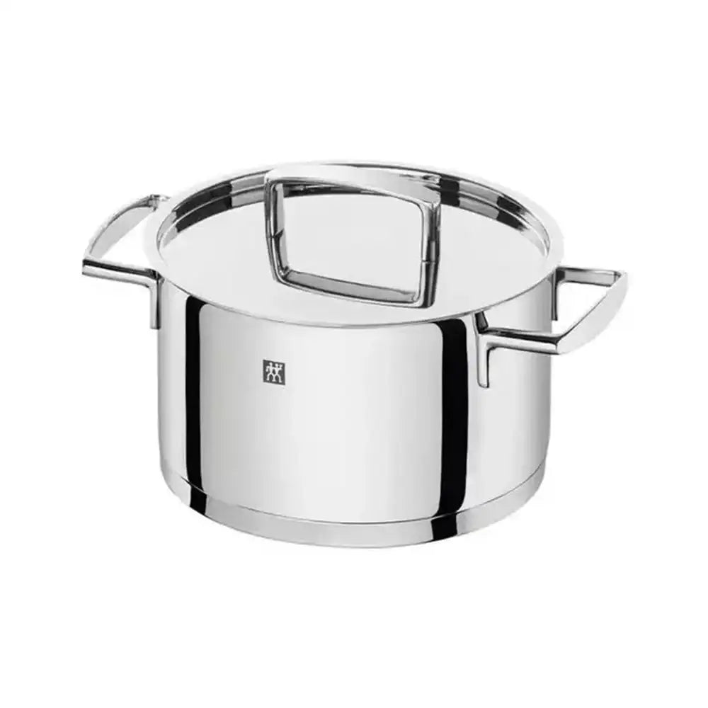 Stainless steel pot with lid on a white background