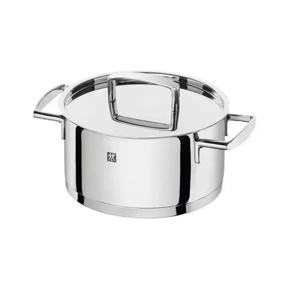 Stainless steel pot with handles on a white background