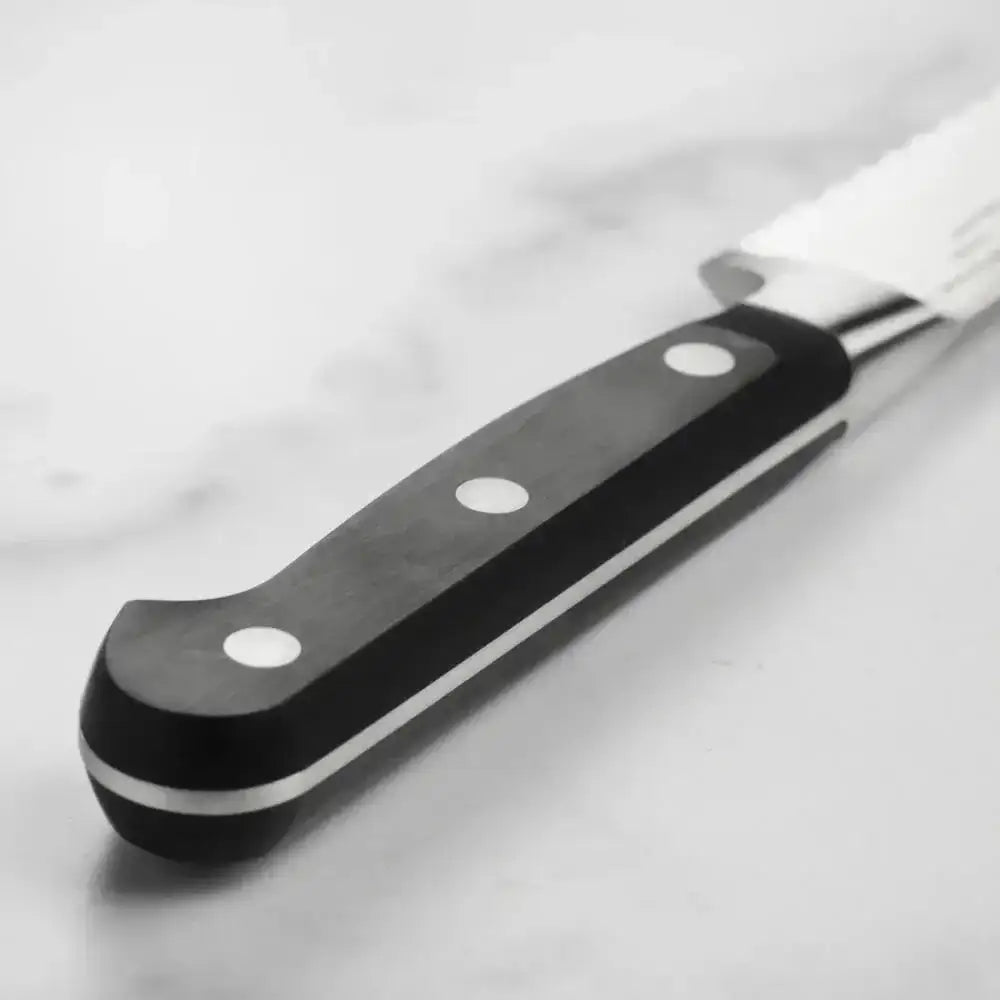 Knife with a black handle on a white background
