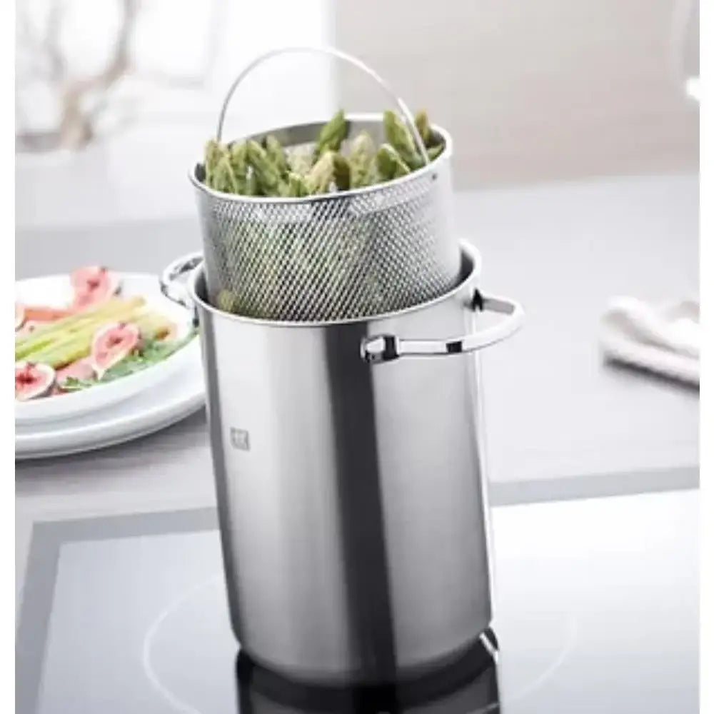 Stainless steel colander with green vegetables on a kitchen counter