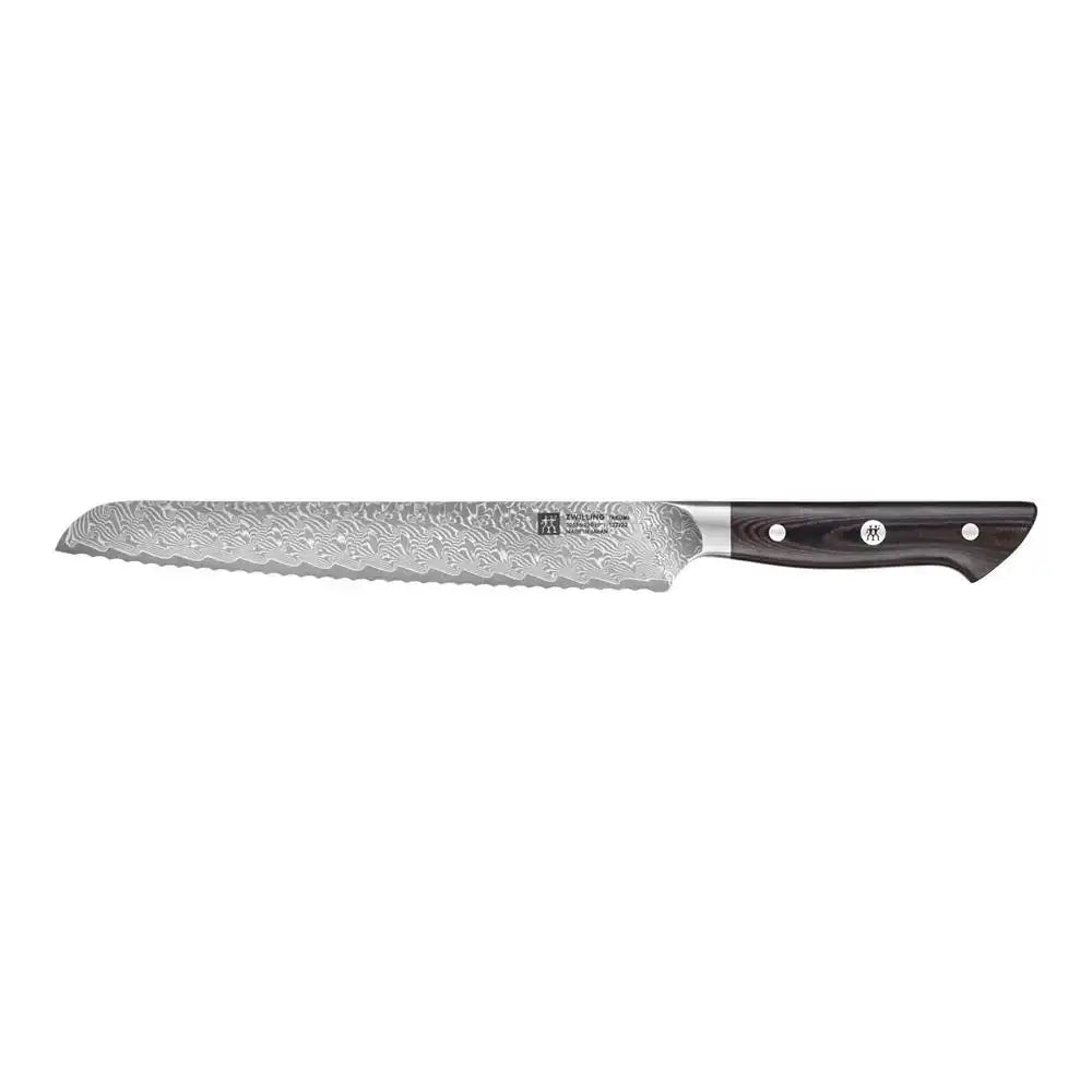 Bread knife with a textured blade and black handle on a white background