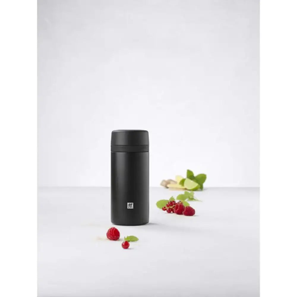 Black thermos bottle on a white background with berries and leaves.