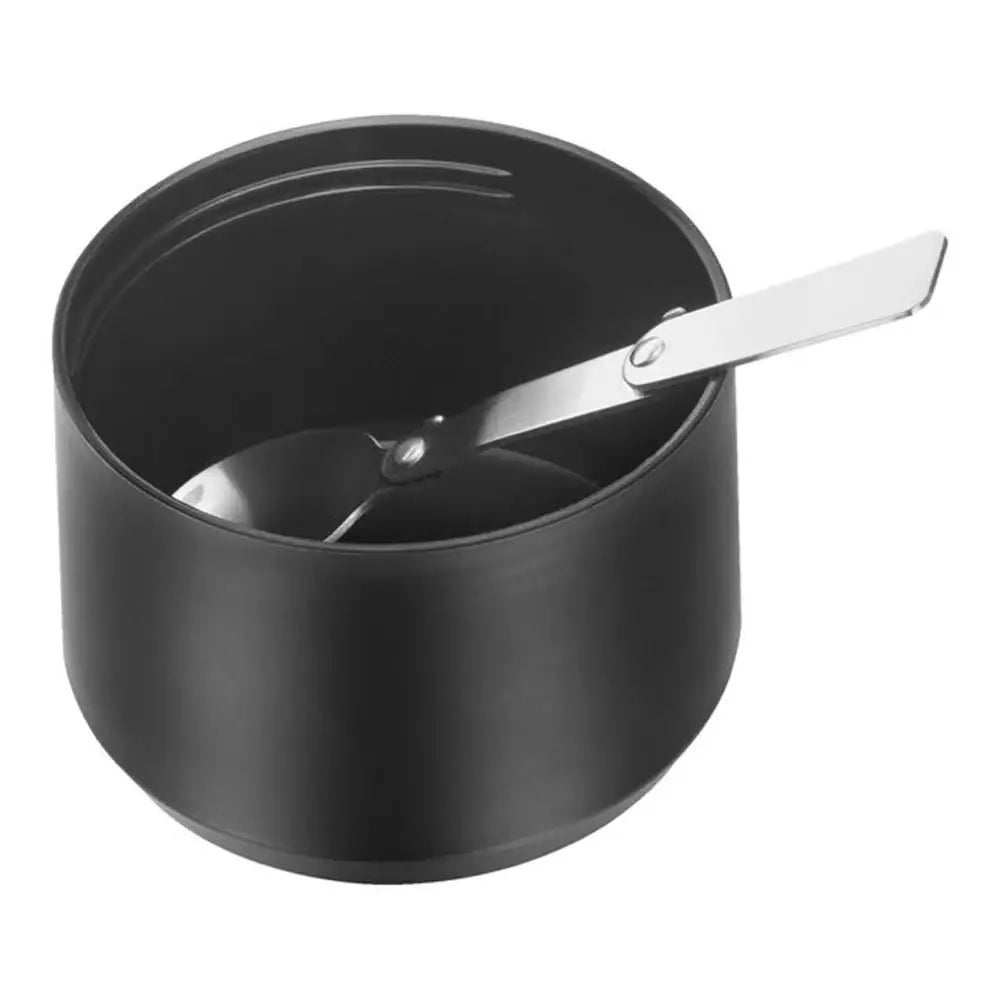 Black pot with a spoon on a white background