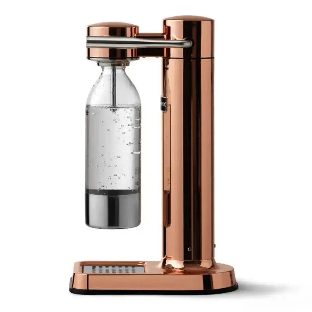 Copper water carbonator with clear bottle and sparkling water on white background
