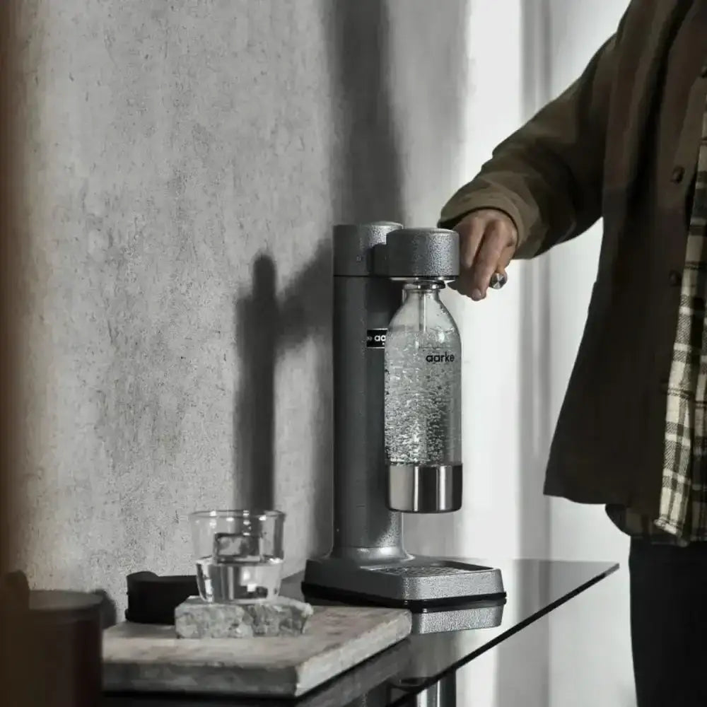 Aarke III premium water carbonator in hammertone grey on kitchen counter at Cookin Stores