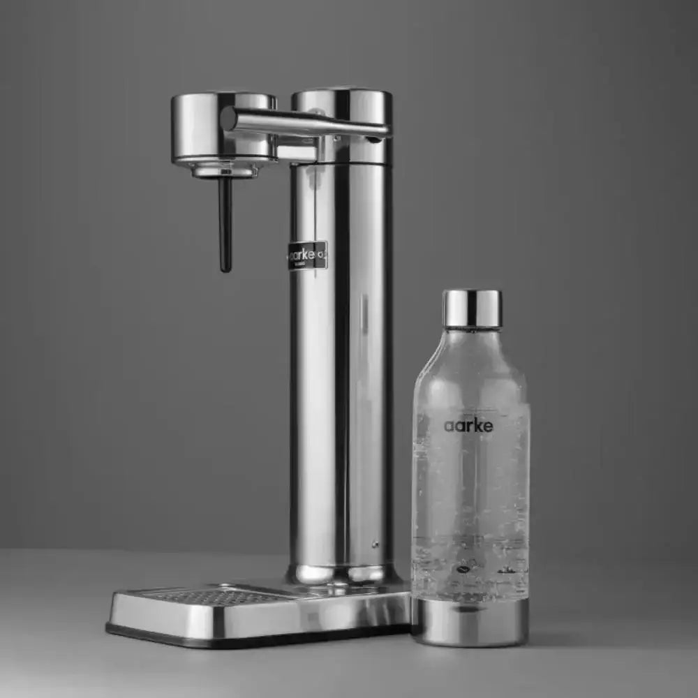 Aarke III premium water carbonator in polished steel with matching bottle, modern kitchenware