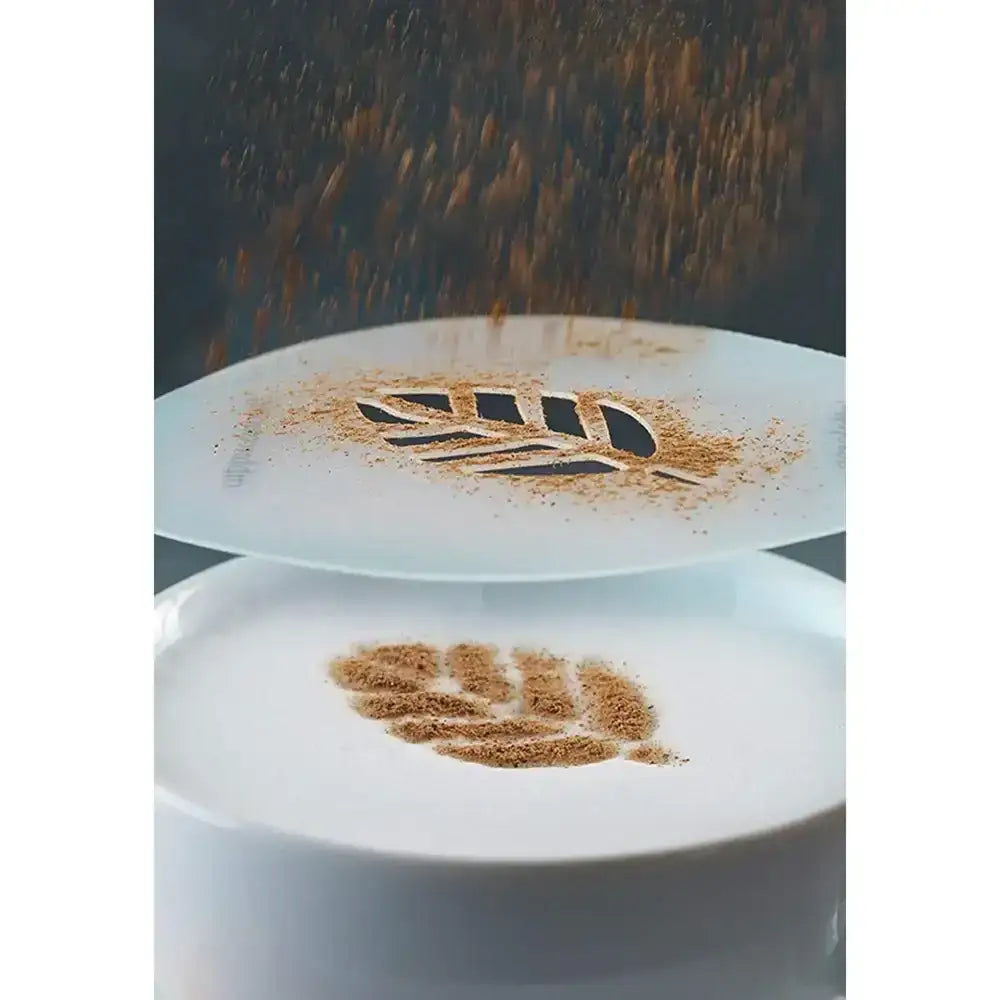 Cappuccino with latte art of a leaf on a white cup against a dark background