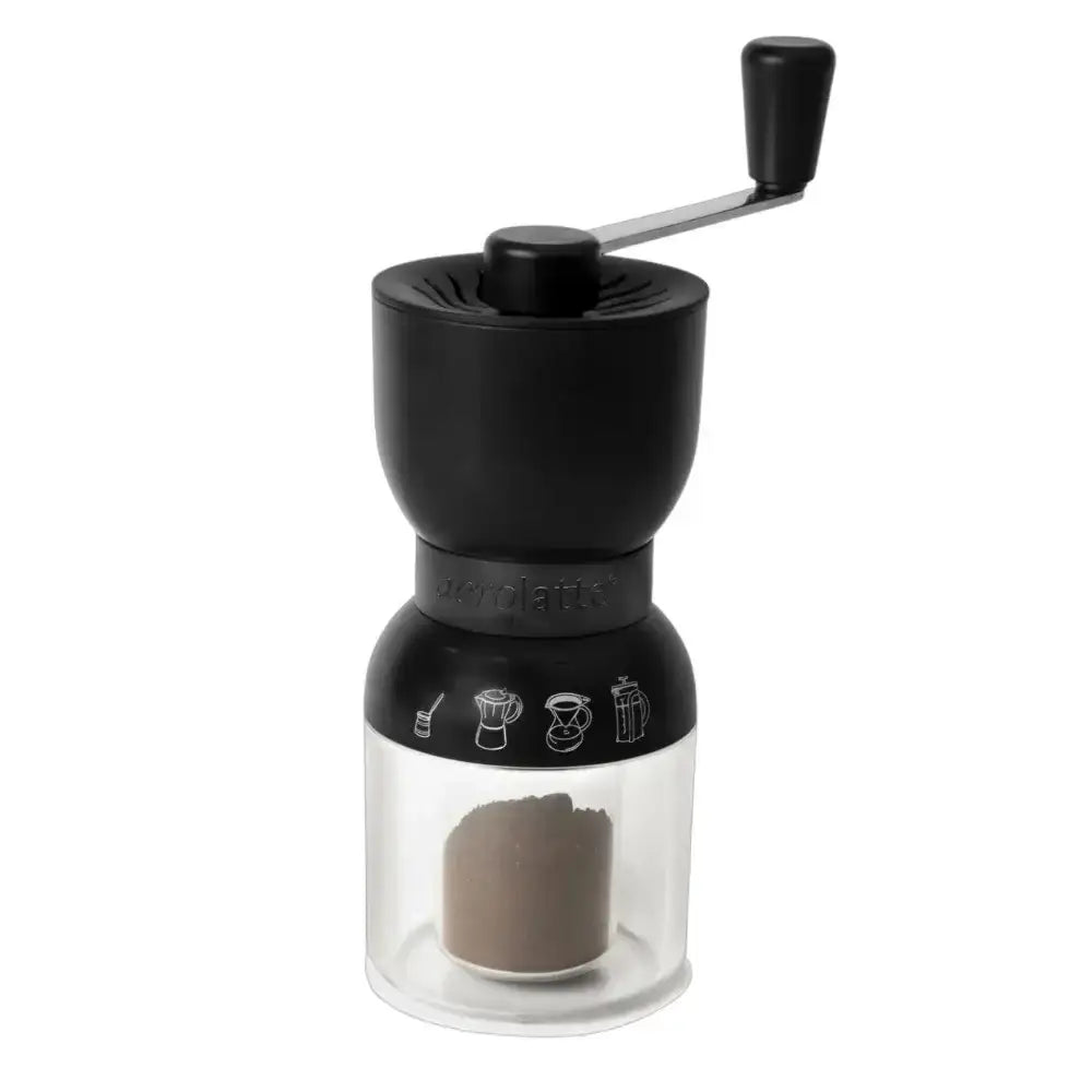 Black manual coffee grinder with clear container on a white background