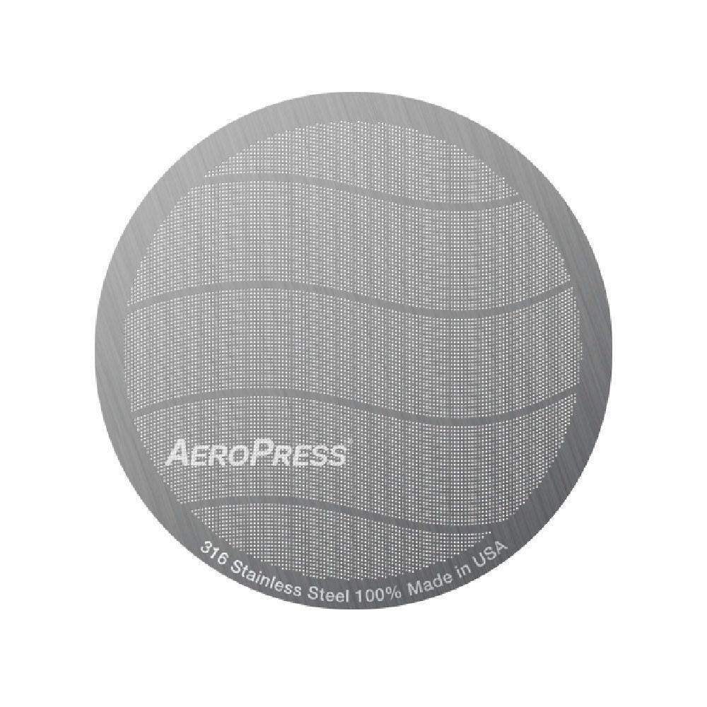 Aeropress coffee filter on a white background
