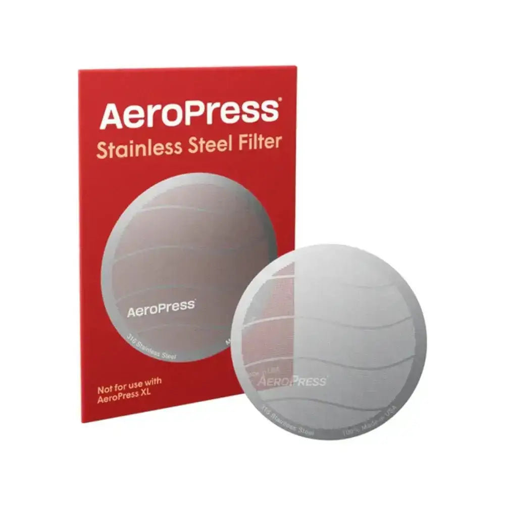 Aeropress stainless steel filter with packaging on a white background