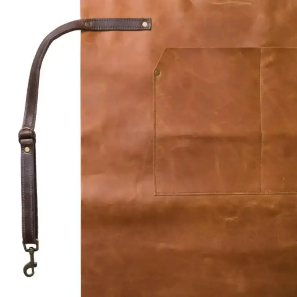 Brown leather apron with a strap on a white background