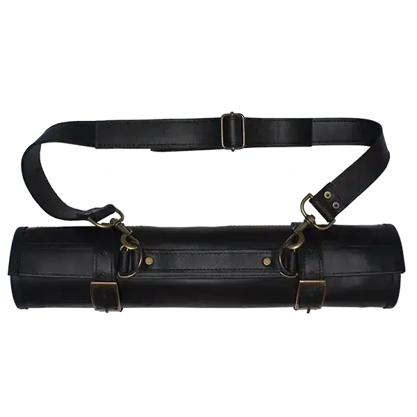 Black leather tool roll with brass hardware on a white background