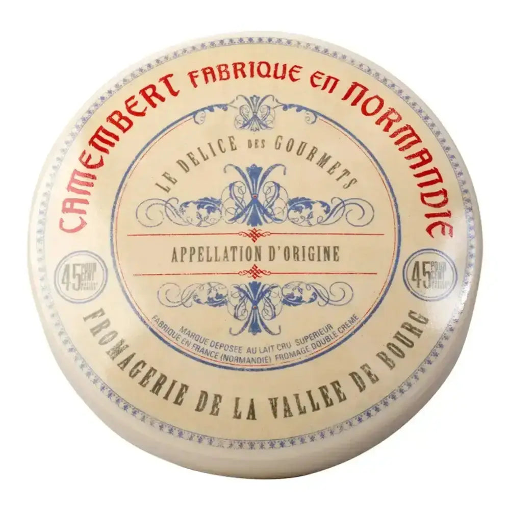 Camembert cheese wheel with decorative label on a white background