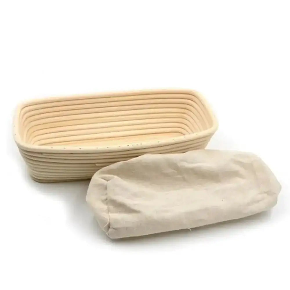 Bread proofing basket with a cloth cover on a white background