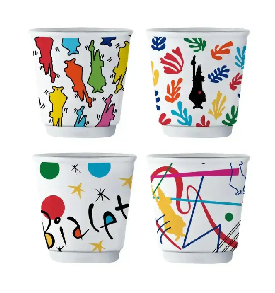 Four colorful ceramic cups with abstract patterns on a white background