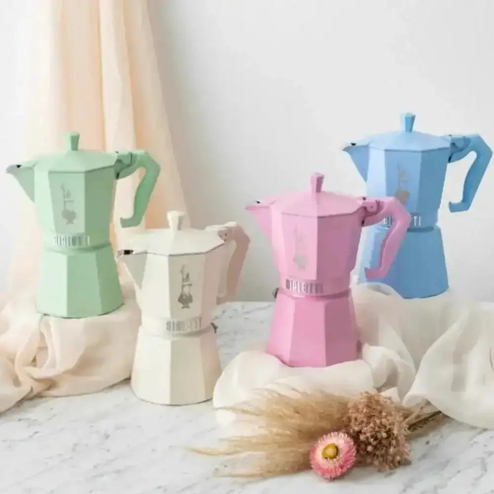 Set of colorful coffee makers on a neutral background