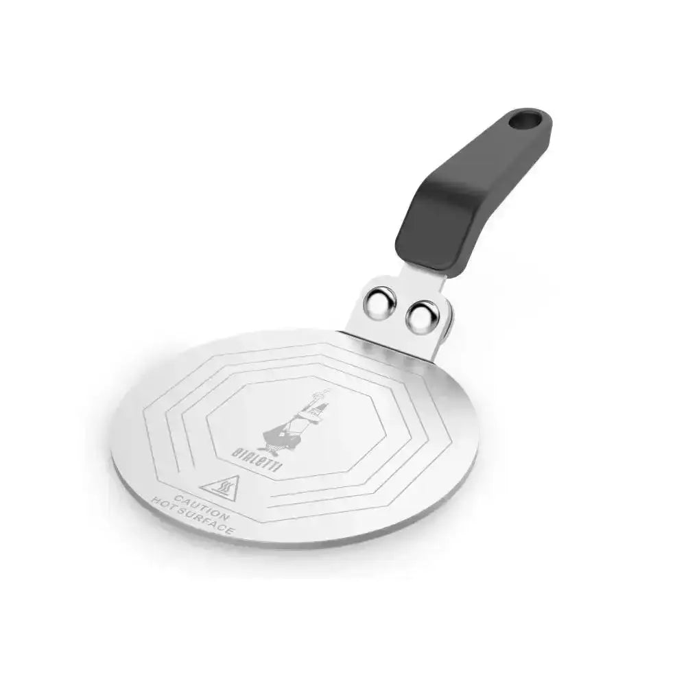 Metal induction stove plate with black handle on a white background