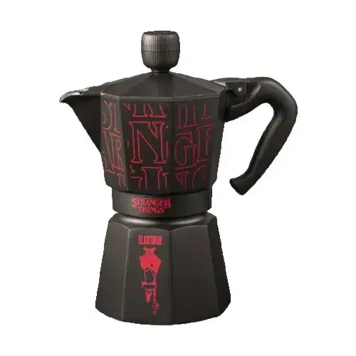 Black coffee maker with red text and 'Stranger Things' branding on a white background