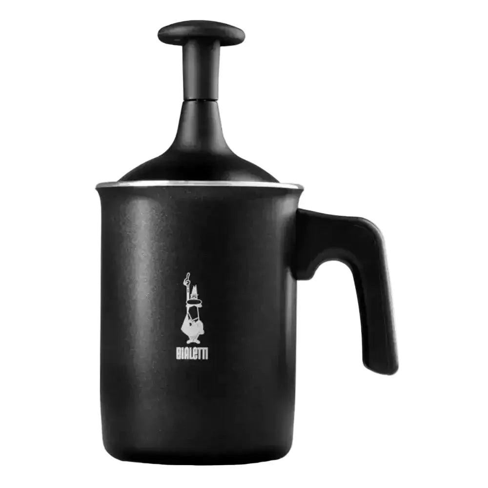 Black milk frother with a handle on a white background