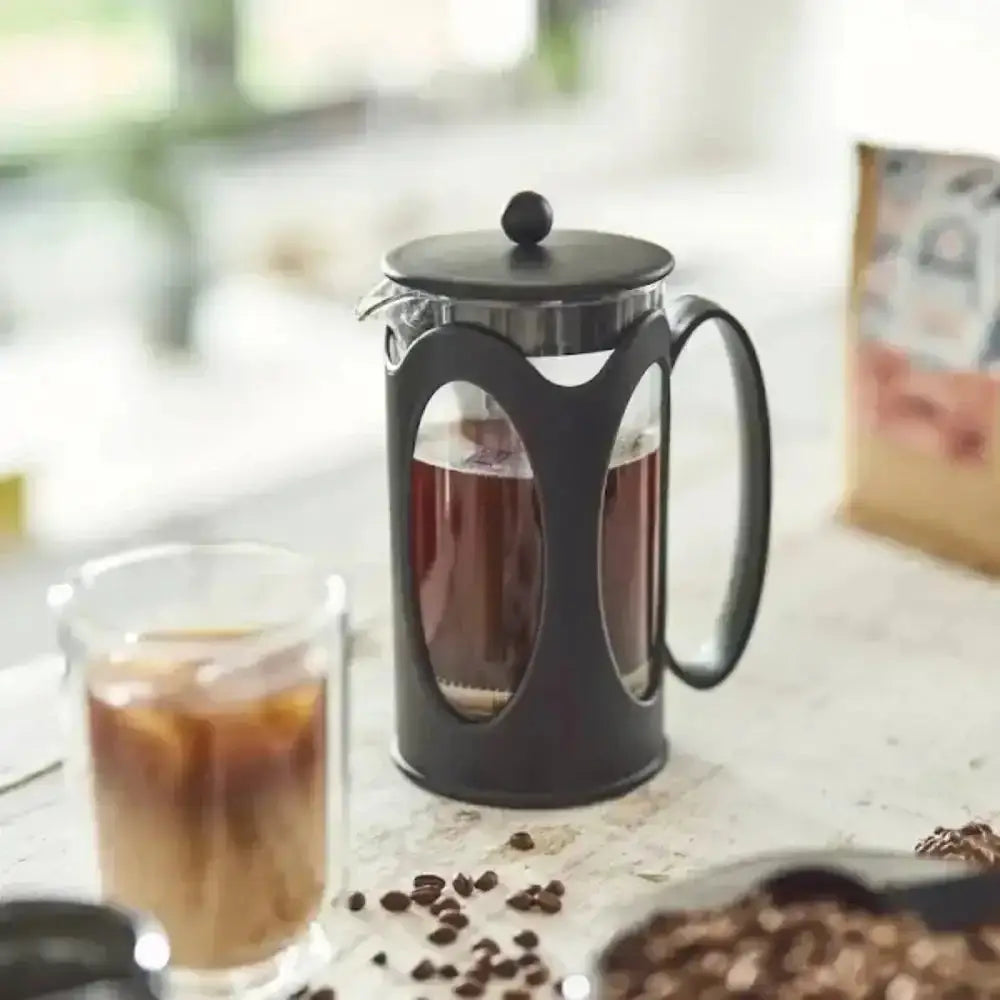 Bodum Kenya French Press Coffee Maker on kitchen table with coffee beans and glass cup, Cookin Stores kitchenware