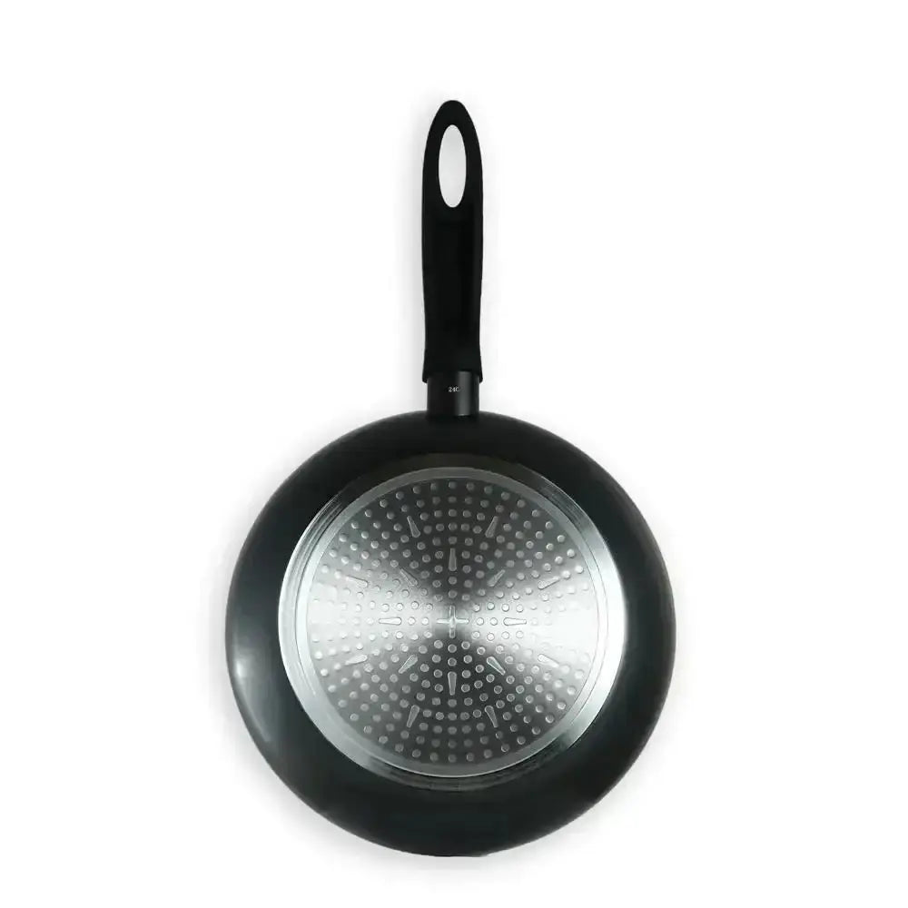 Black frying pan with a perforated bottom on a white background