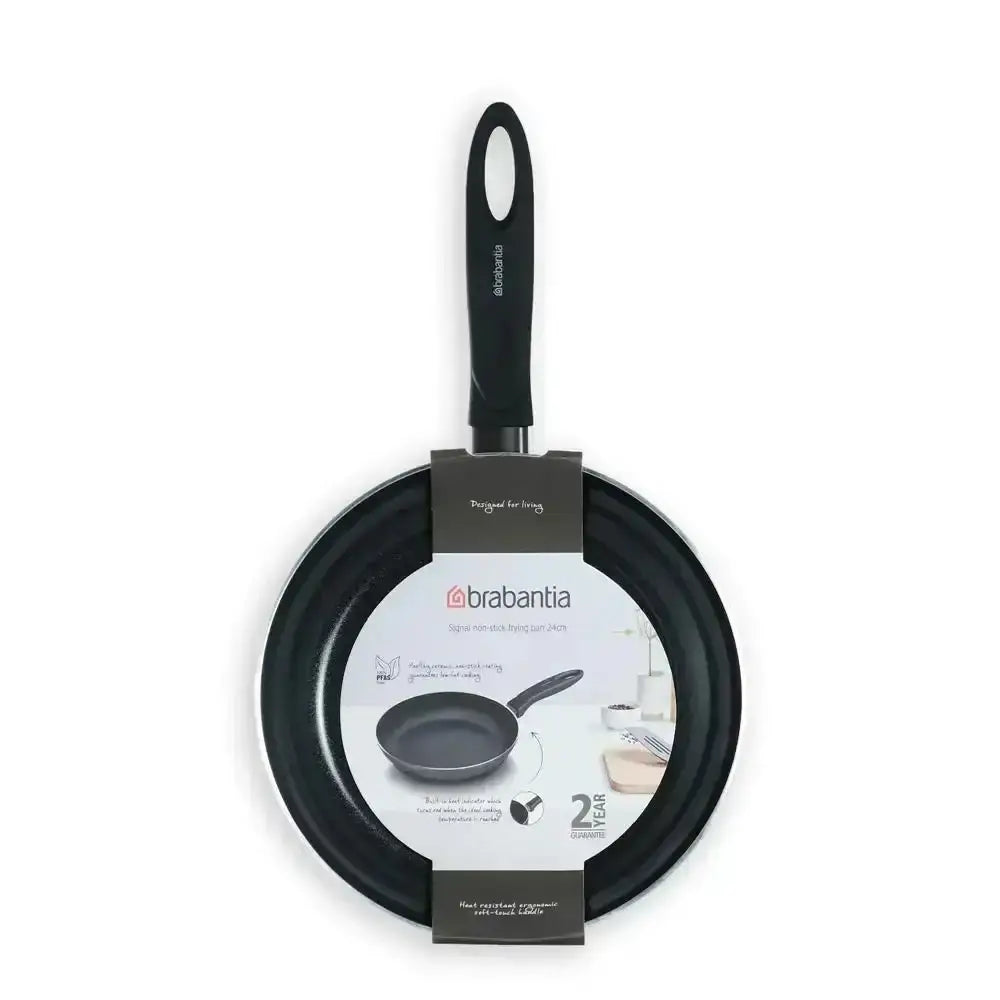 Black frying pan with handle and Brabantia label on a white background