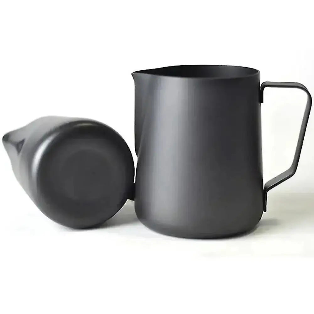 Black milk frothing pitcher with a spout on a white background