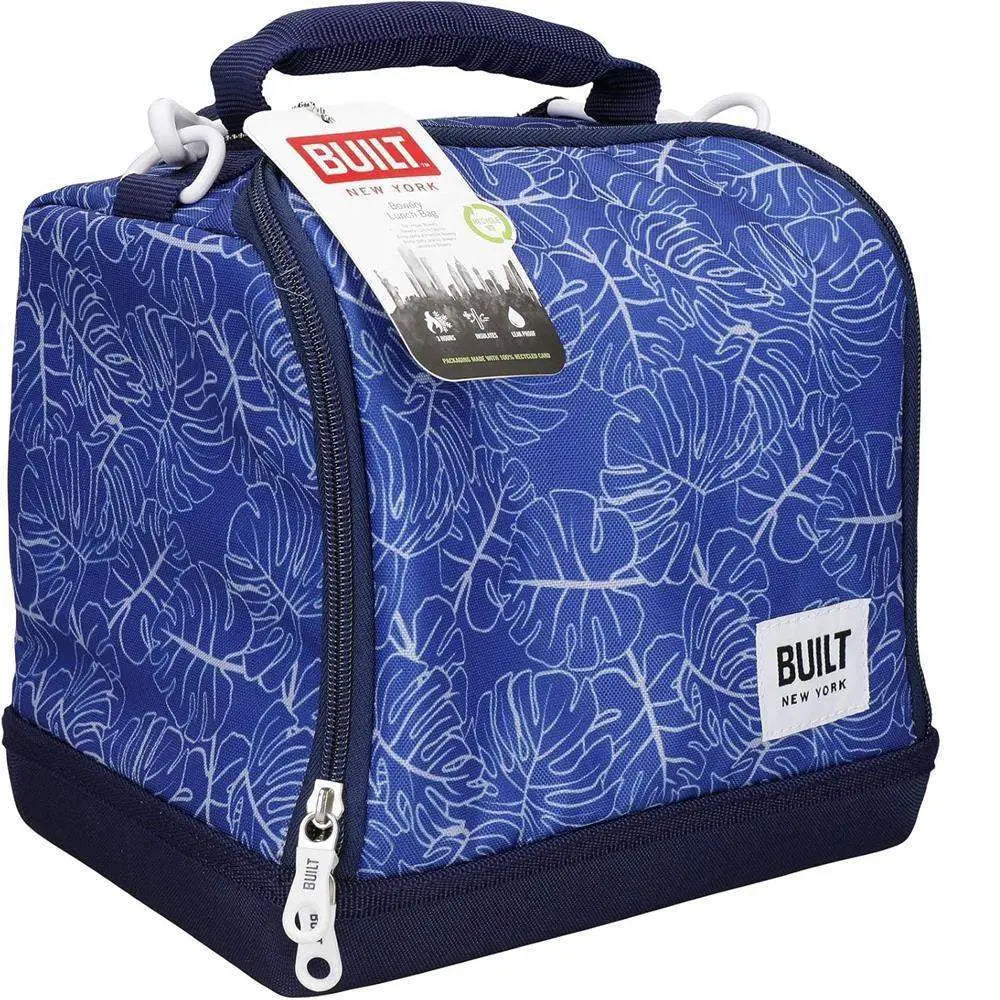 Blue insulated lunch bag with leaf pattern and Built New York tag on a white background