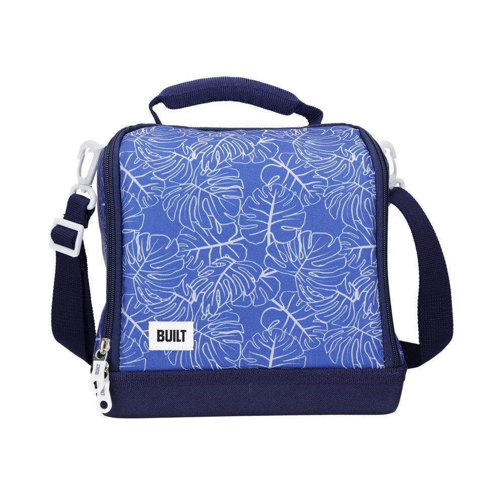 Blue insulated lunch bag with white leaf pattern on a white background