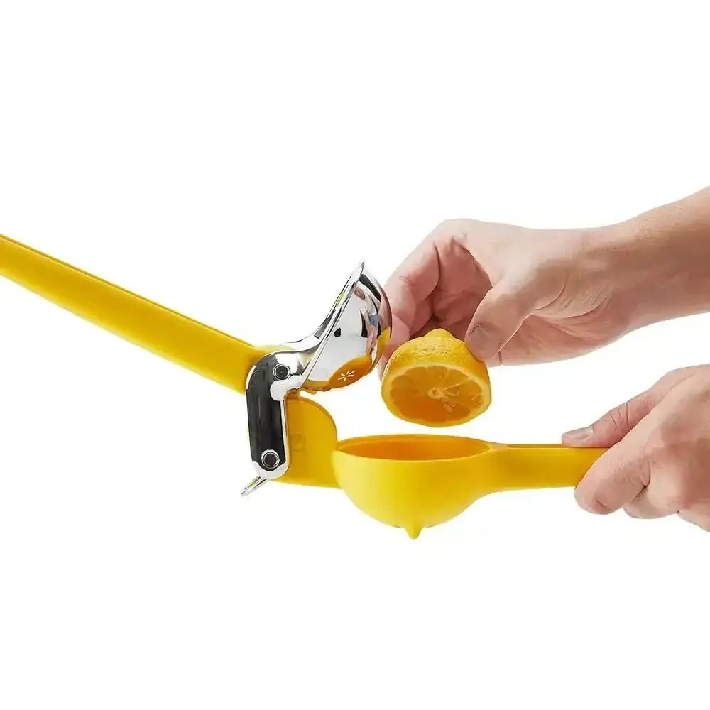 Person using a yellow lemon squeezer to extract juice from a lemon on a white background