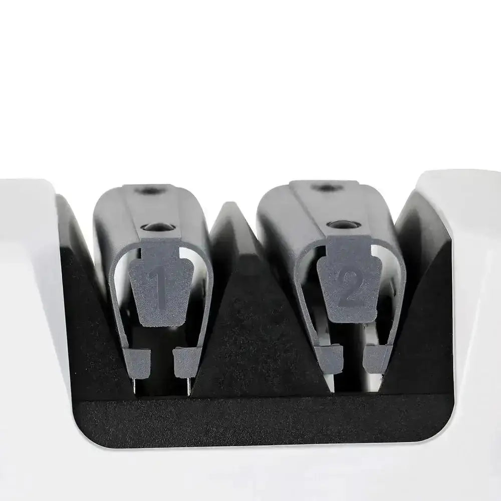 White plastic chef’s choice 320 electric knife sharpener with two gray metal numbered sharpening slots