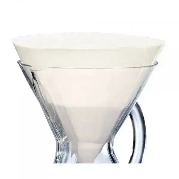 Clear glass with white liquid on a white background