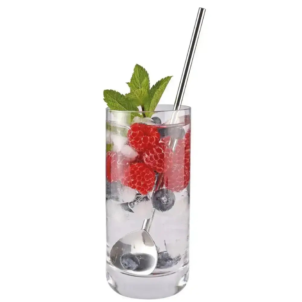 Glass of berry cocktail with ice, mint, and stainless steel cilio cocktail spoon straw