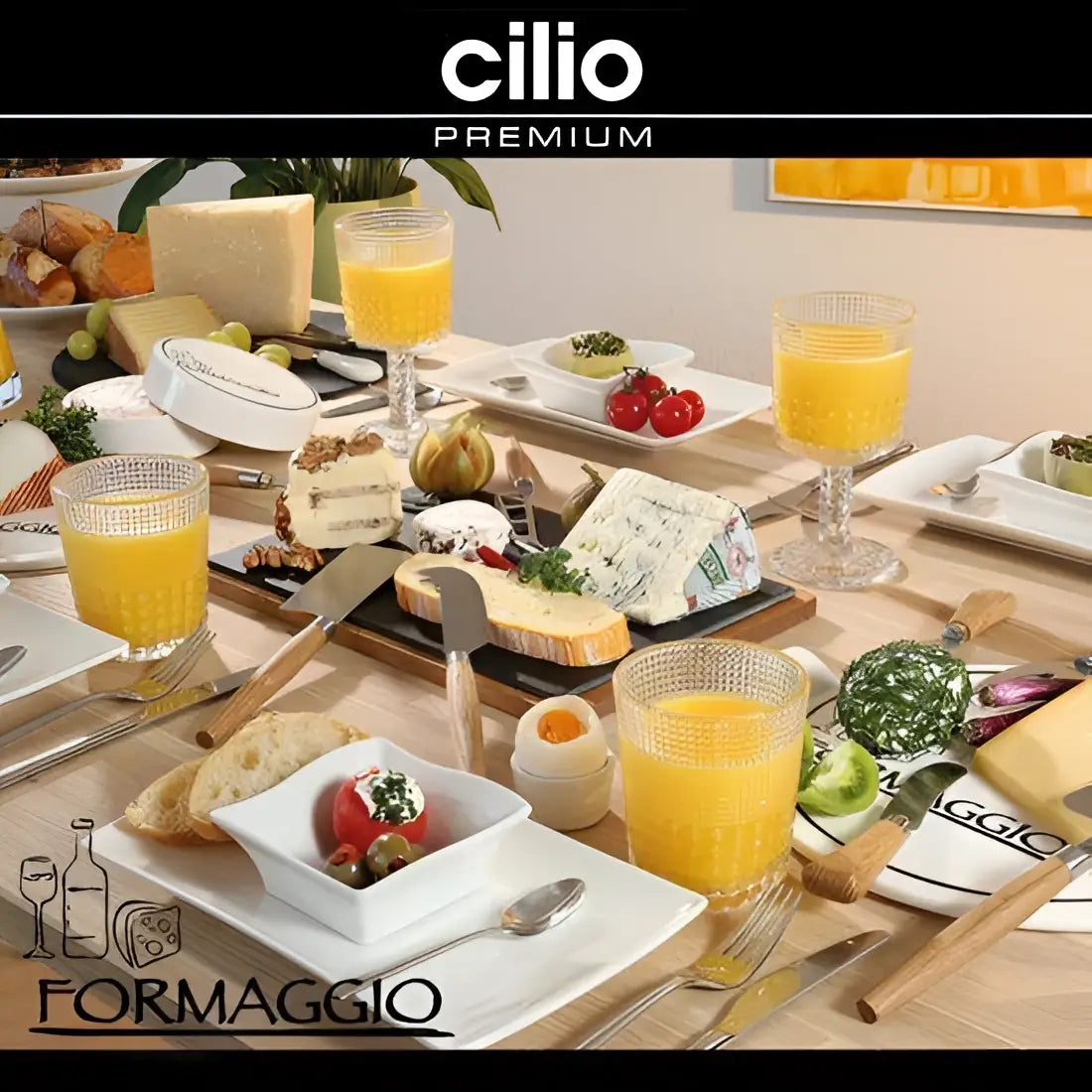 Elegant breakfast setting with assorted cheeses, orange juice, bread, and premium kitchenware