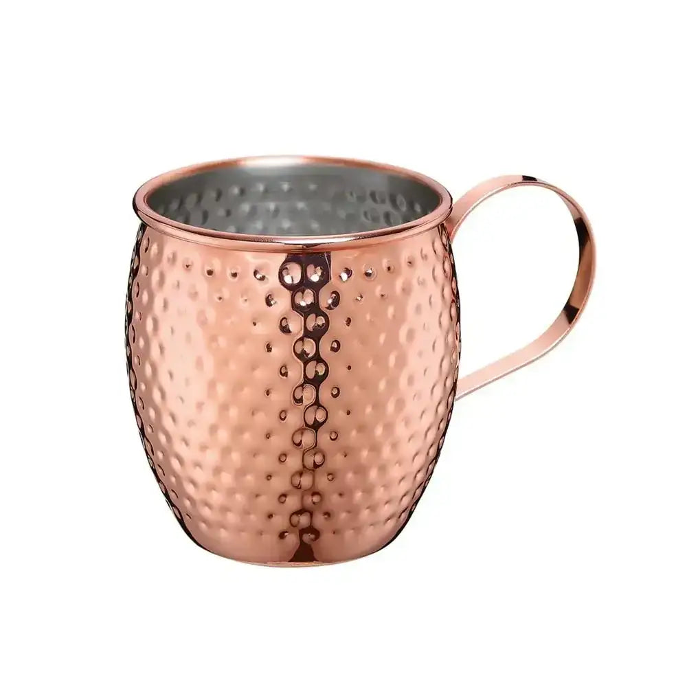 Copper mug with a textured surface on a white background