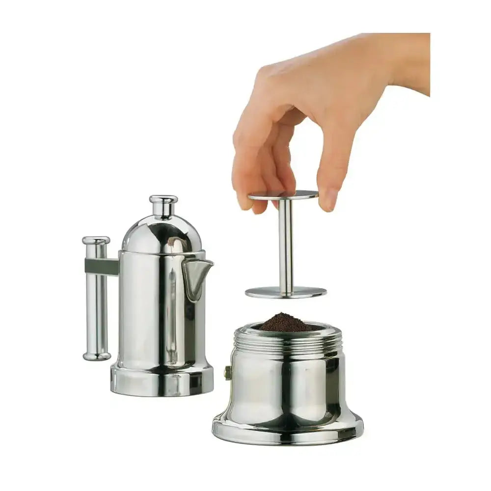 Silver coffee press with a hand holding a plunger on a white background