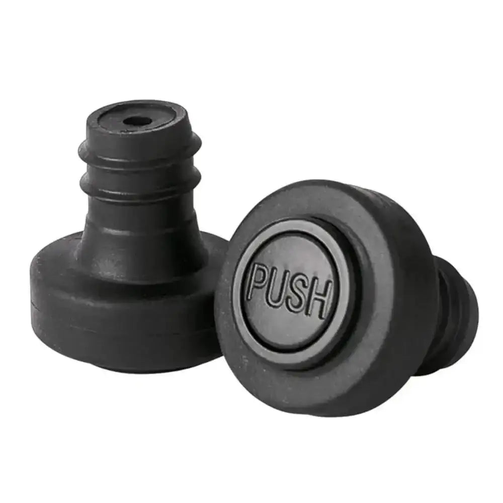 Black rubber bottle cap with 'PUSH' text on a white background
