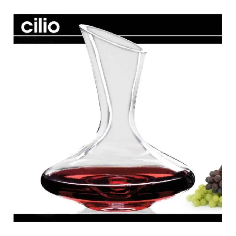 Wine decanter with red wine and grapes on a white background, featuring the brand 'cilio'.