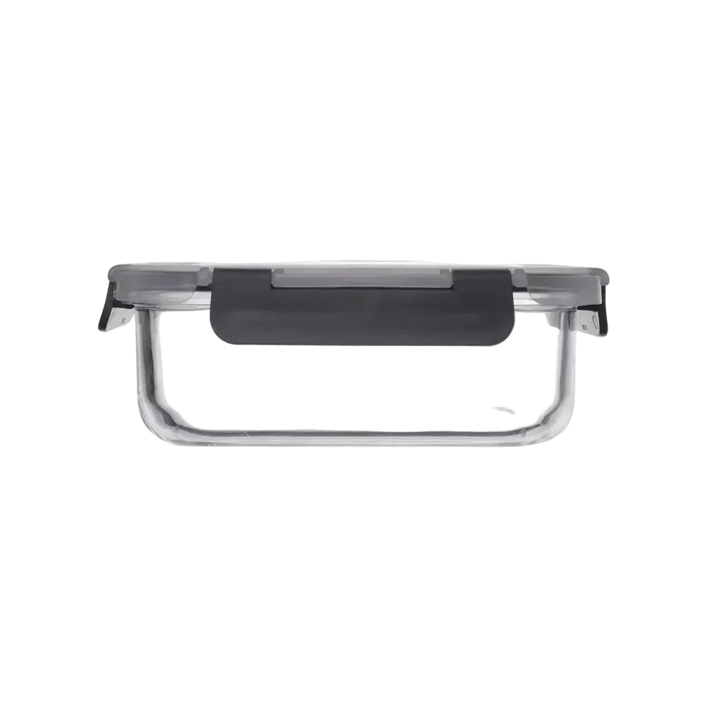 Clear glass food container with a black lid on a white background