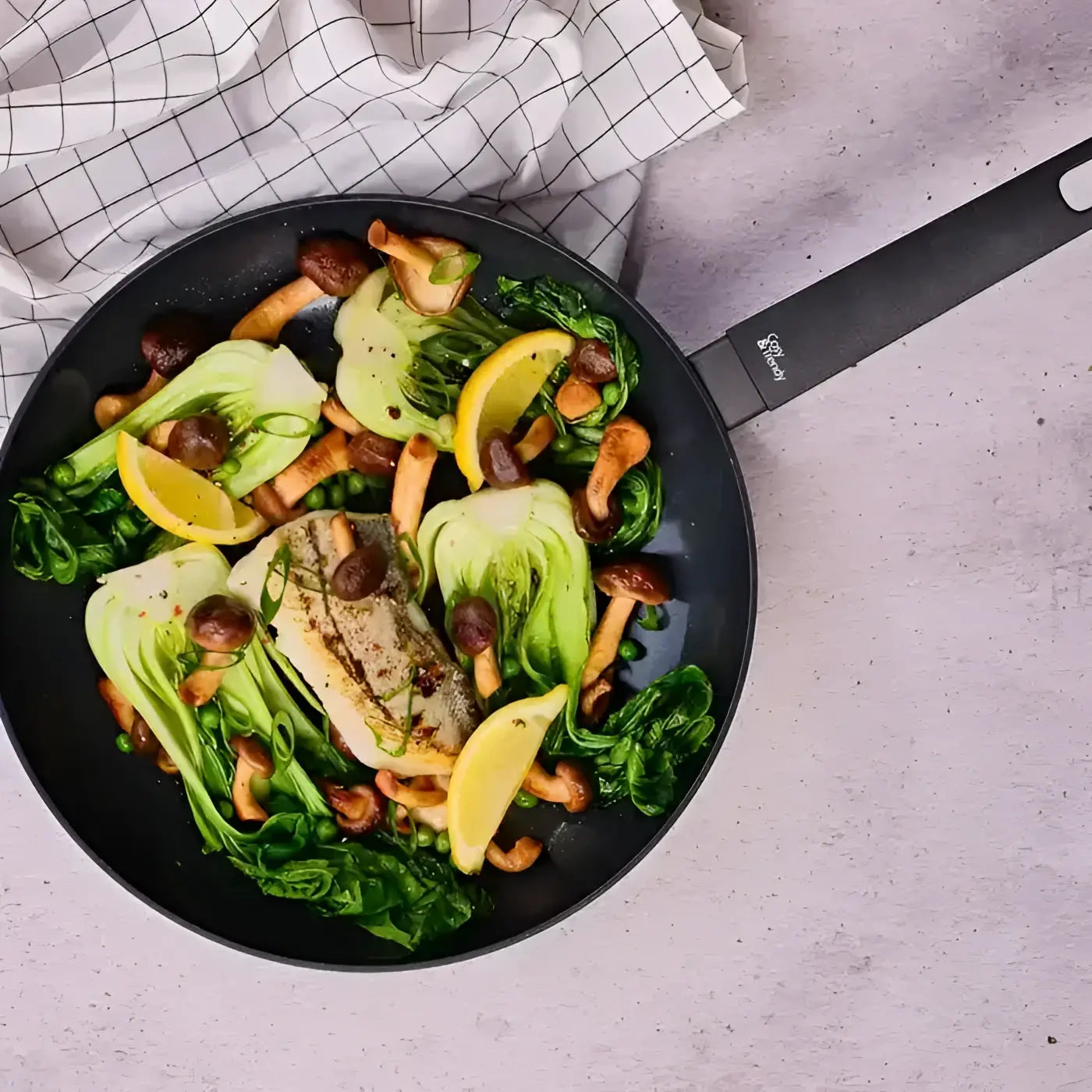 Black cosy & trendy ceramic non-stick frying pan 24cm with sleek handle and fissler brand logo on the side
