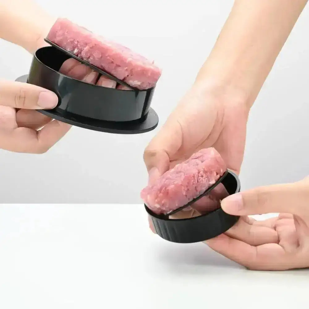 Person using a meat tool on ground meat.