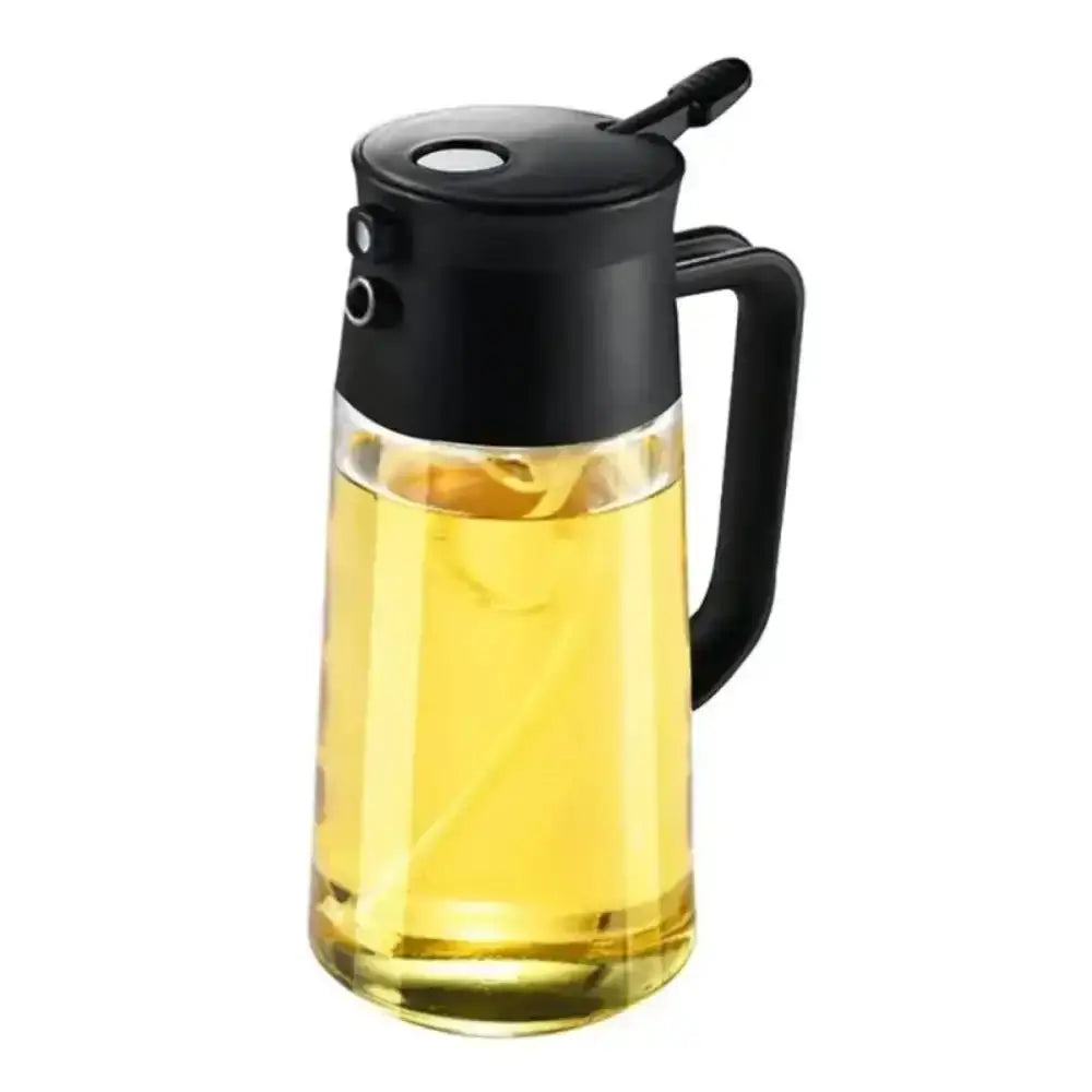 Glass container with black lid and handle filled with a yellow liquid on a white background