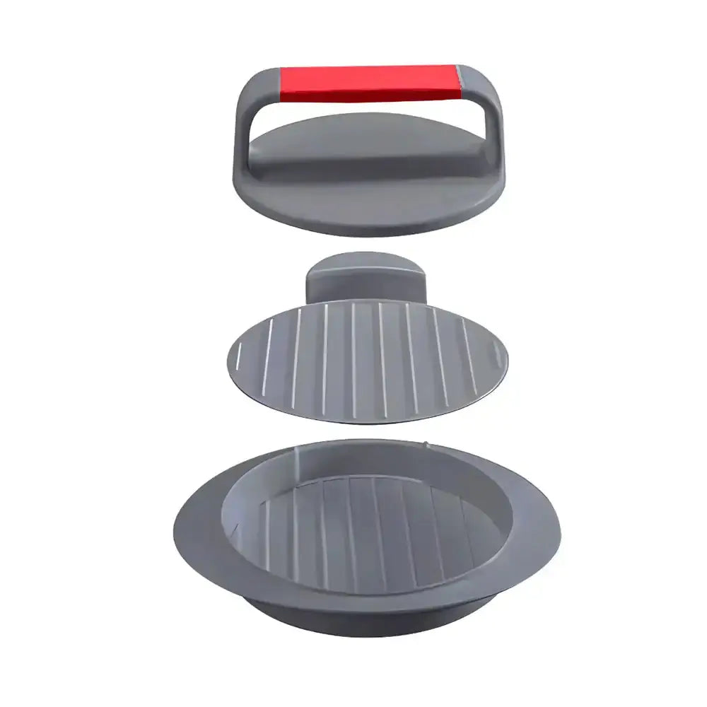 Gray burger press with a red handle on a white background