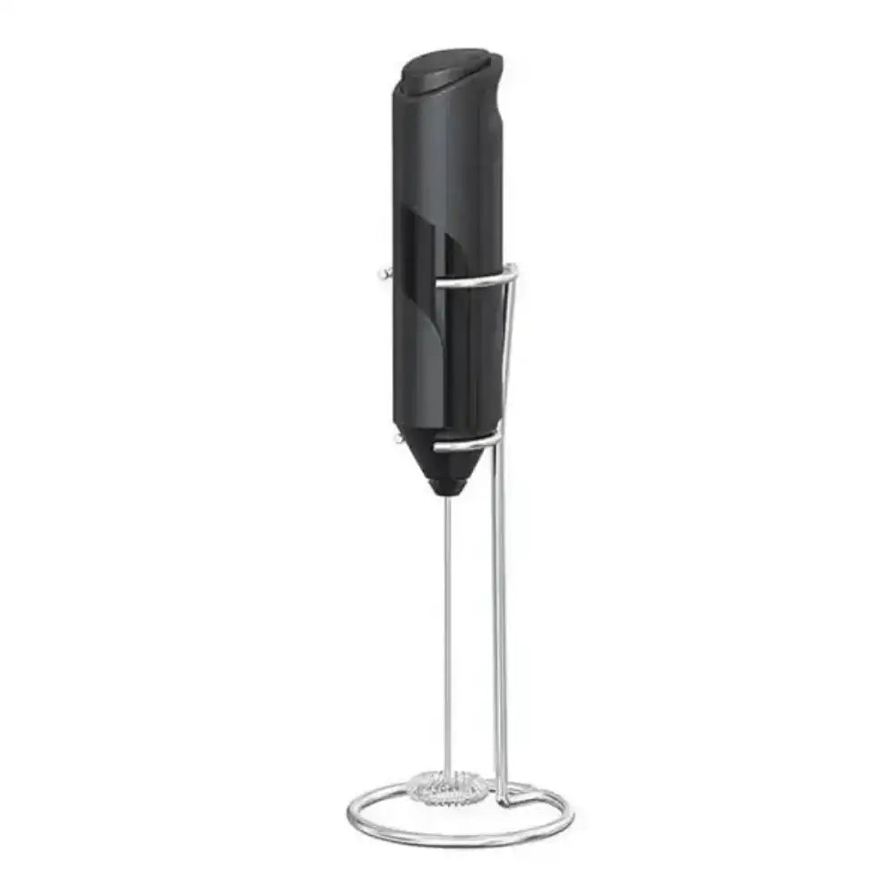 Black handheld milk frother with stand on a white background