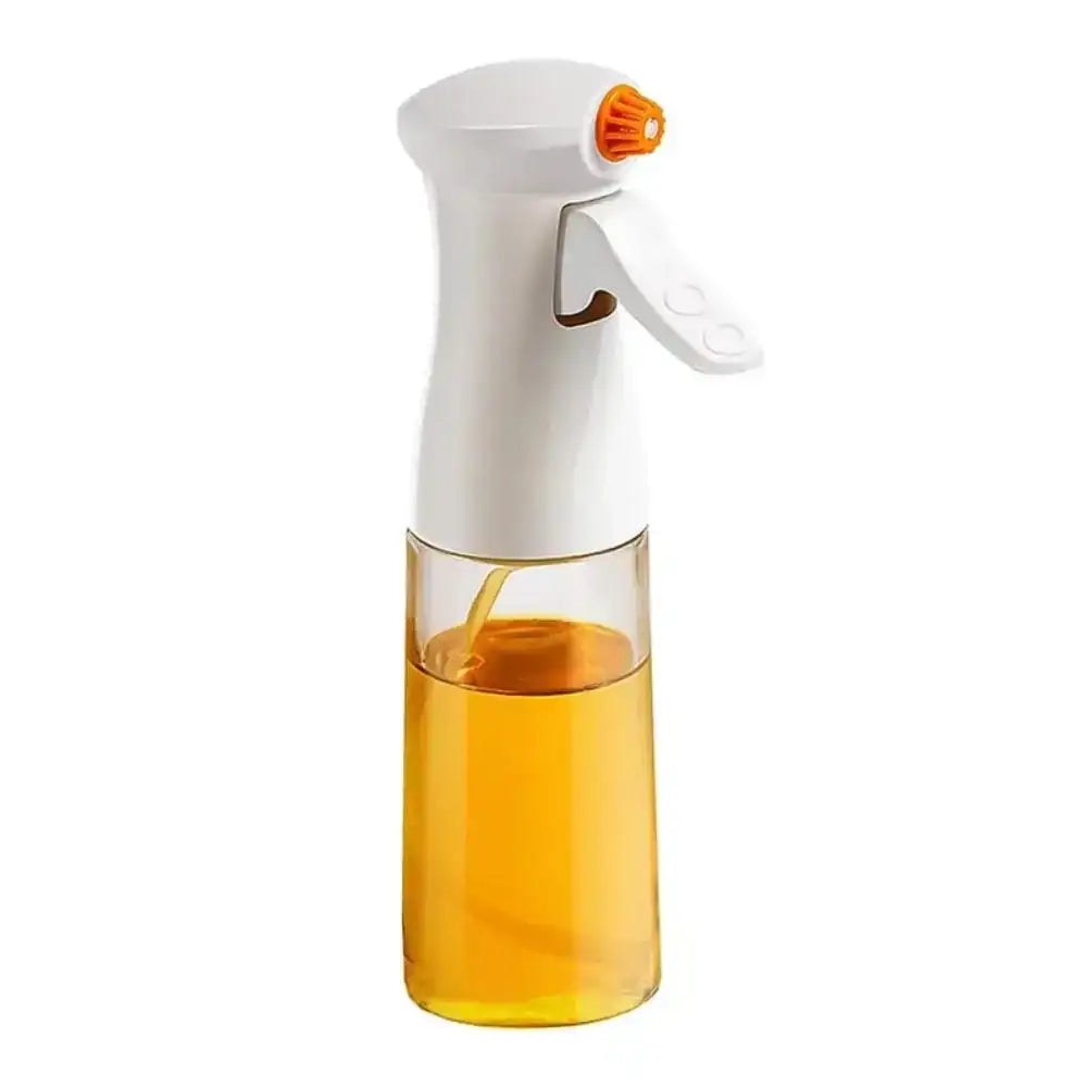 Spray bottle with orange liquid on a white background