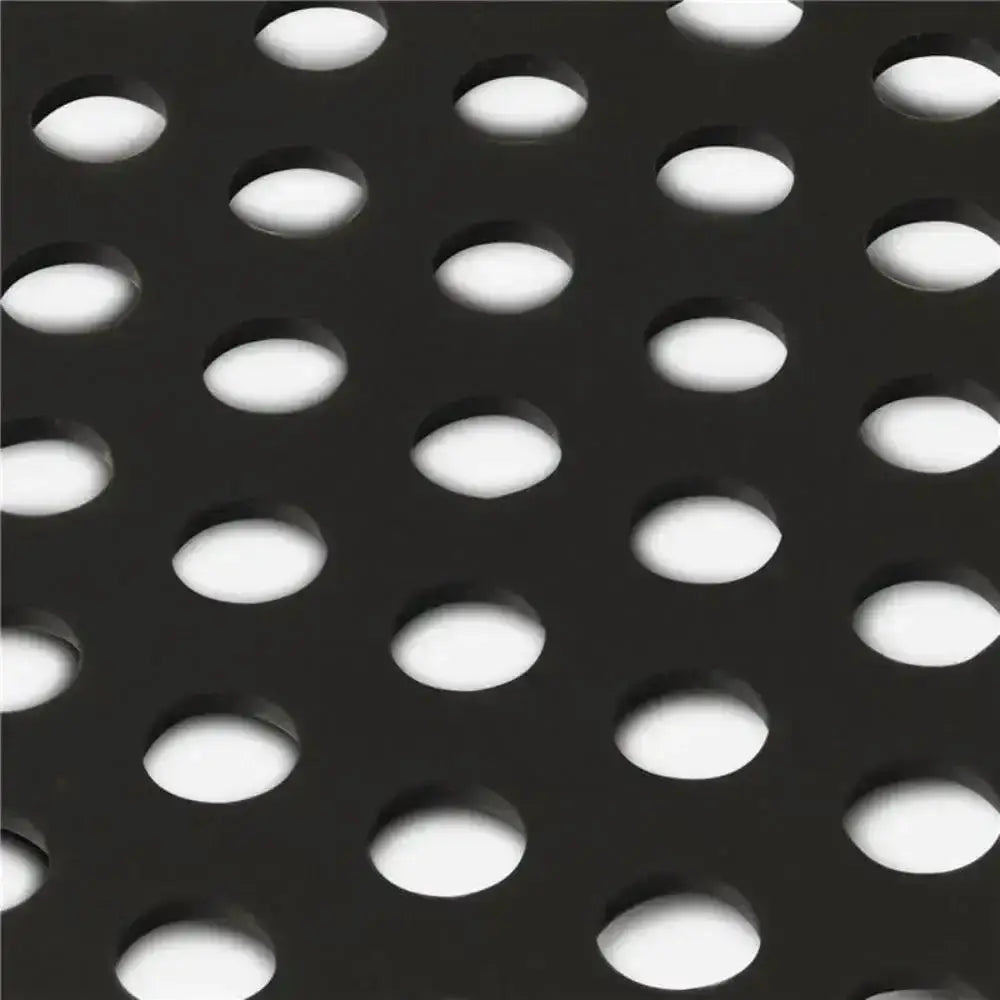 Close-up of a black metal grid with circular holes